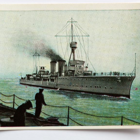 image of soldier looking out to sea at an incoming ship.