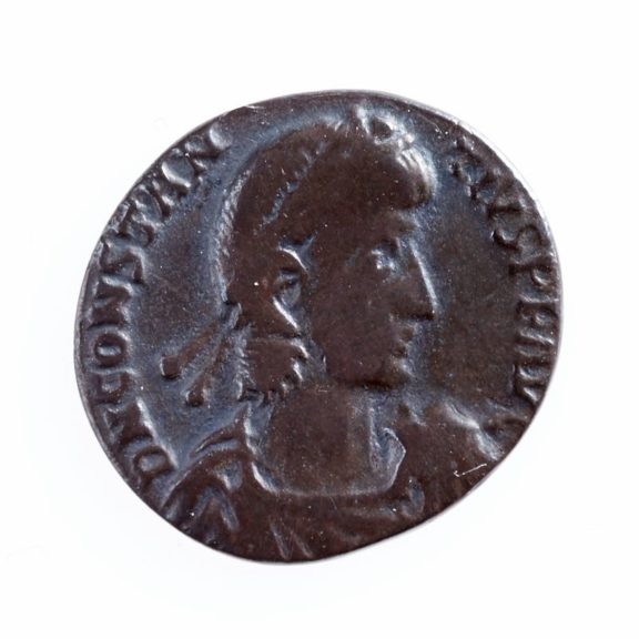 A Roman's silhouette carved onto a coin.