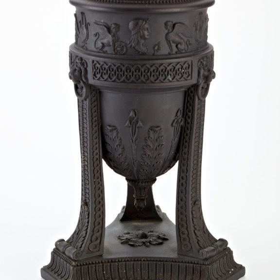 dark coloured ornate basin with decorative legs.