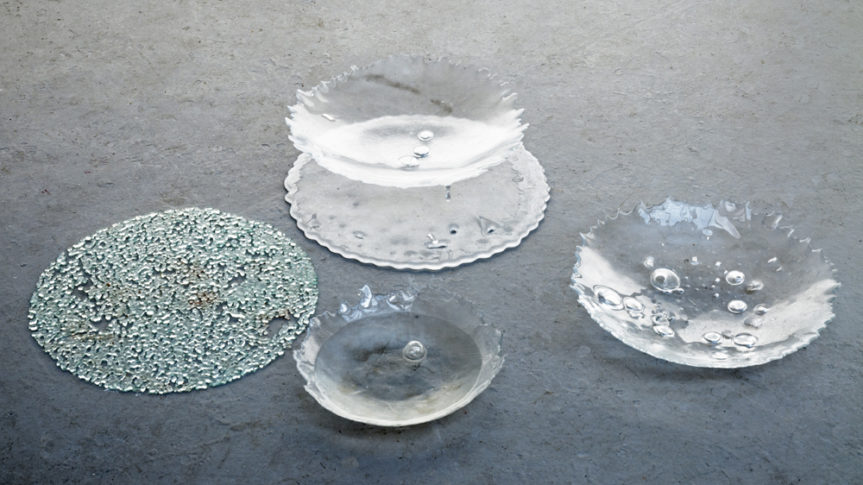 a series of glass bowls with imperfections in them caused by the riots