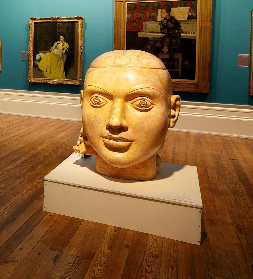 Image shows ladies head made of plaster. The head is large and is places in the centre of the Harris' art gallery.