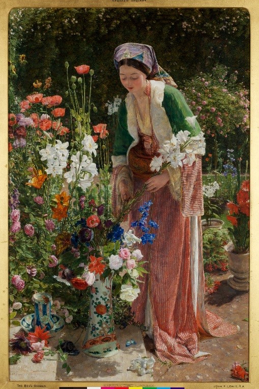 Well dressed Lady in garden tending to an array of flowers