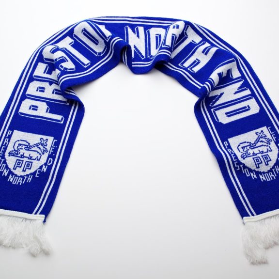 Blue football scarf with the words 'Preston North End' printed across it. Preston Crest (Preston Lamb) also printed in white on it.