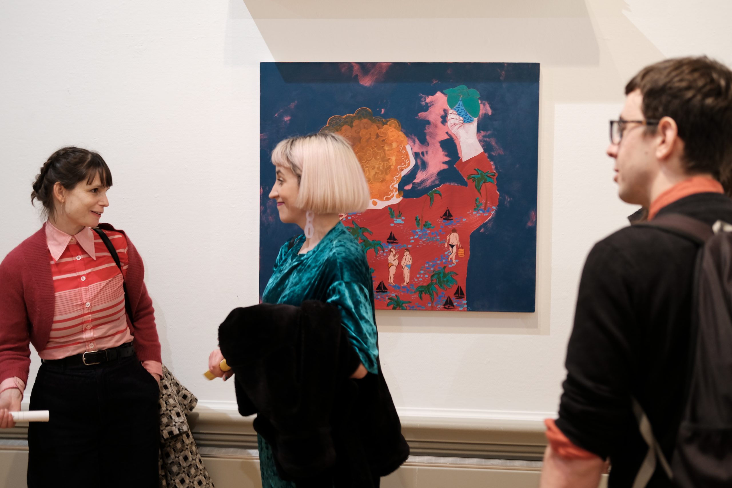 Visitors talking to each other stood in the More T'North exhibition when the Harris building was open.