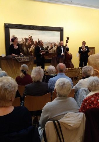 Friends of the Harris listening to live music performance