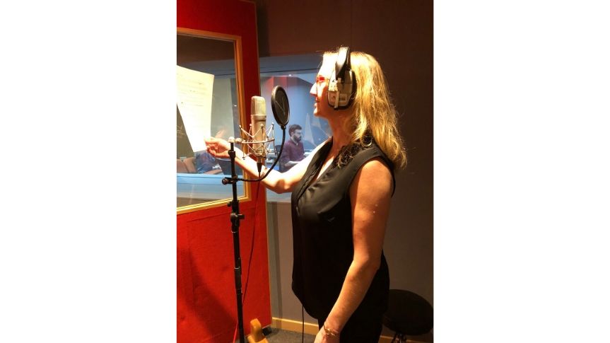 Lorraine in recording studio recording voice over for video piece