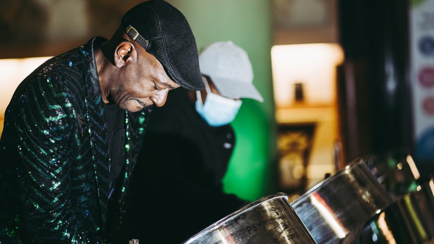 Two men playing steel drums