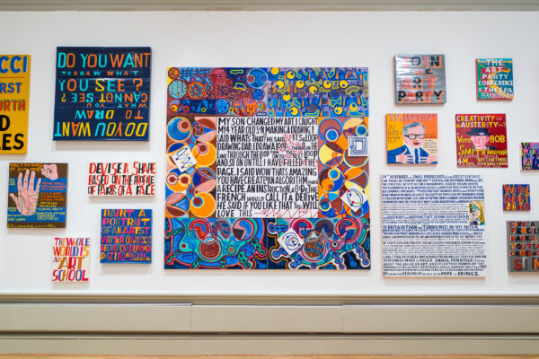 The artist Bob and Roberta's slogan style art work on the gallery wall in the Harris Art galleries