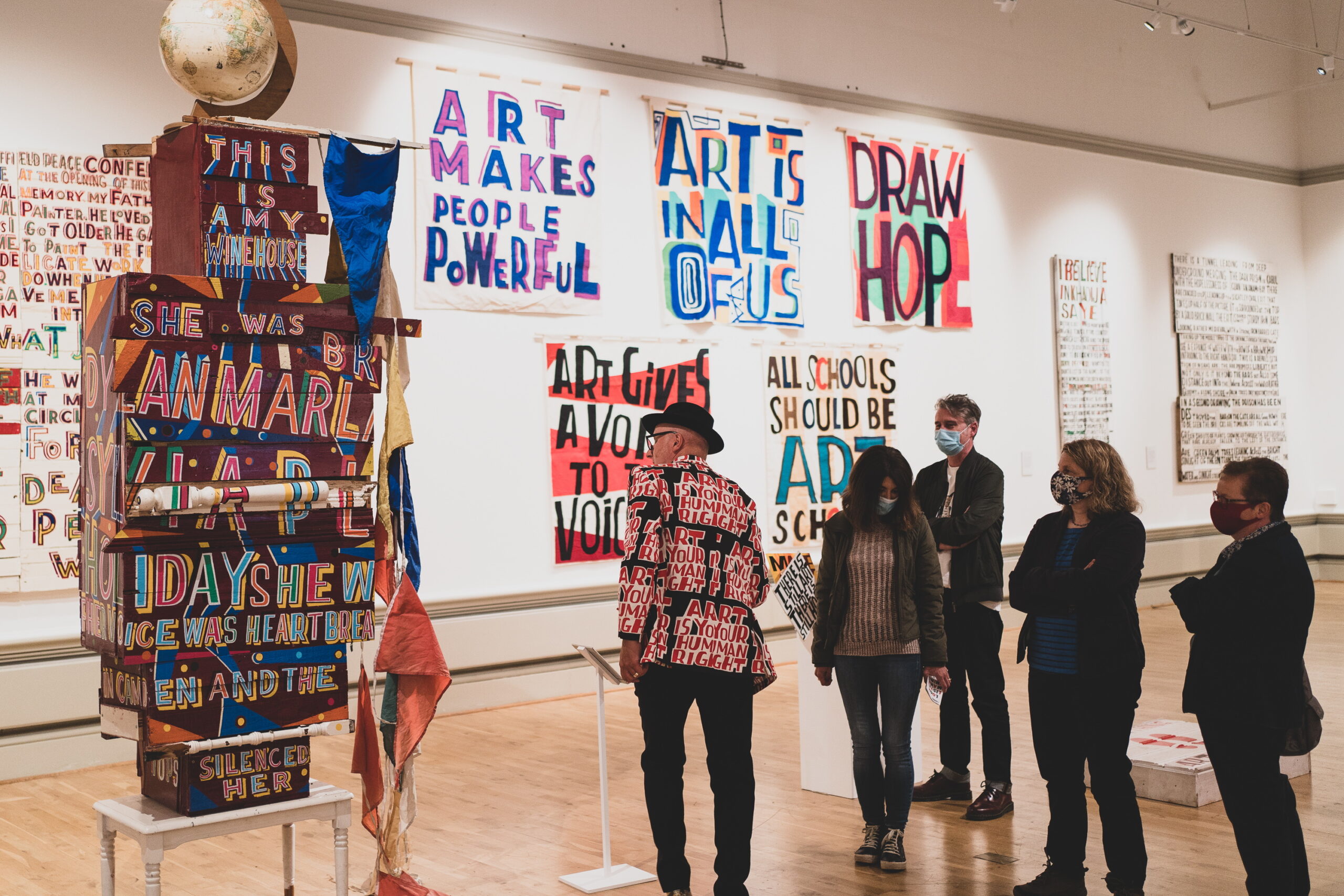 The artist with visitors in the gallery