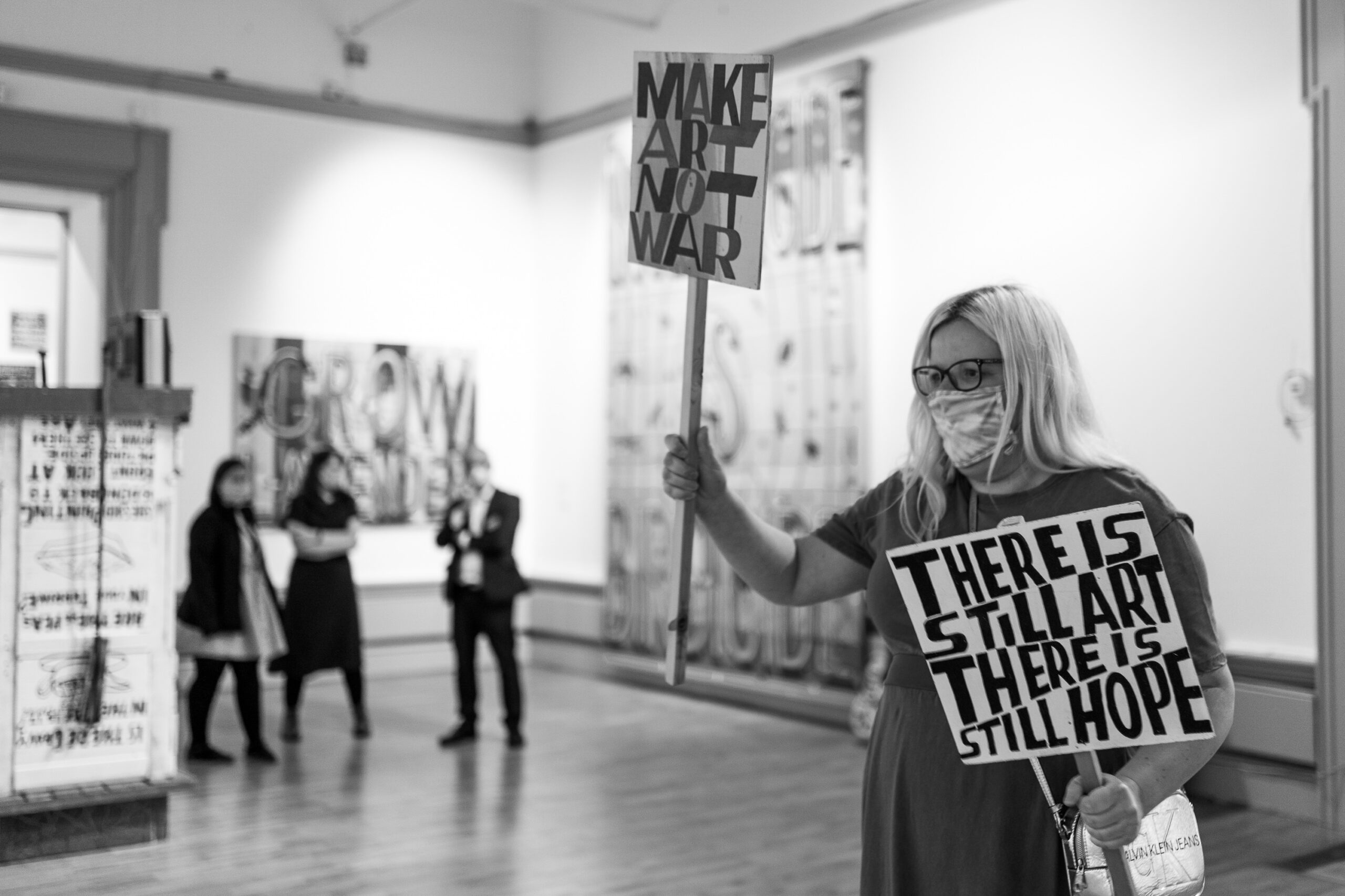 Person holding a placard