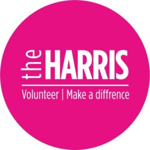 The Harris volunteer logo appearing on a fuchsia background and white text overlay: 'Volunteer, make a difference.