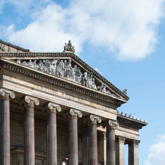 Image of the Harris exterior building zoomed in on the top pediment feature