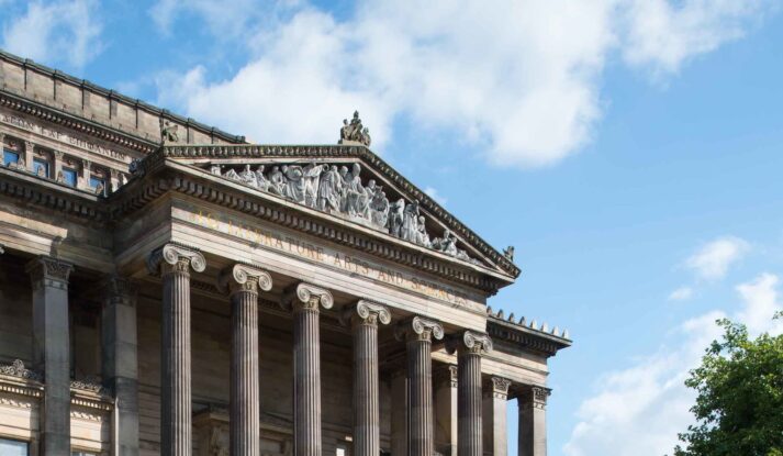 Image of the Harris exterior building zoomed in on the top pediment feature