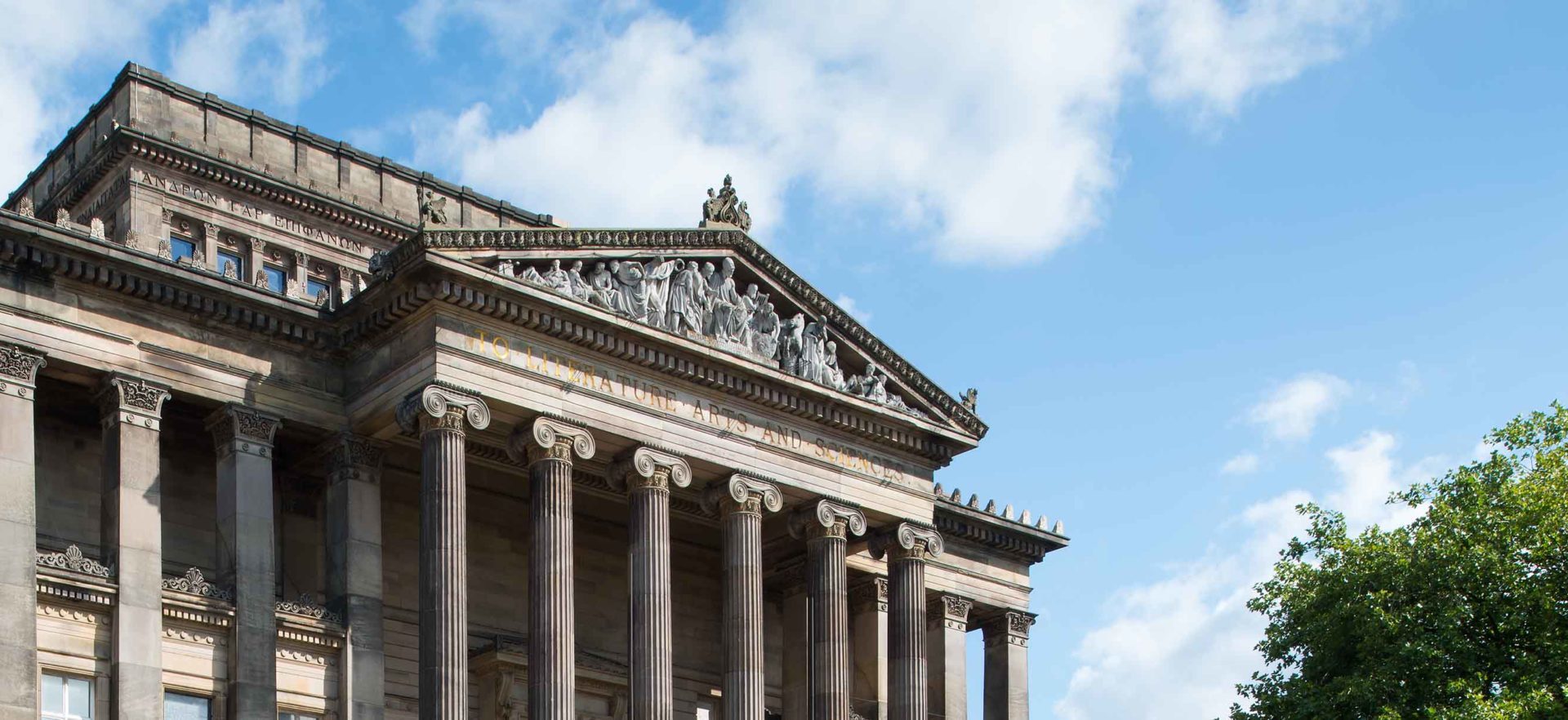 Image of the Harris exterior building zoomed in on the top pediment feature