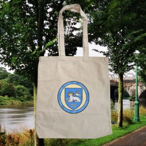 A white canvas bag featuring the Preston crest.