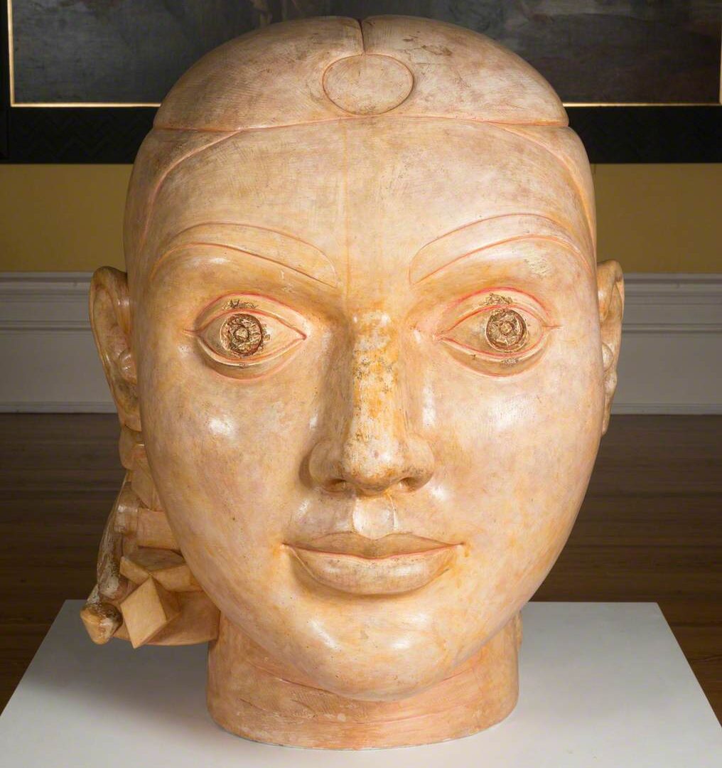 Bust created from plaster and shellac of a women's head.