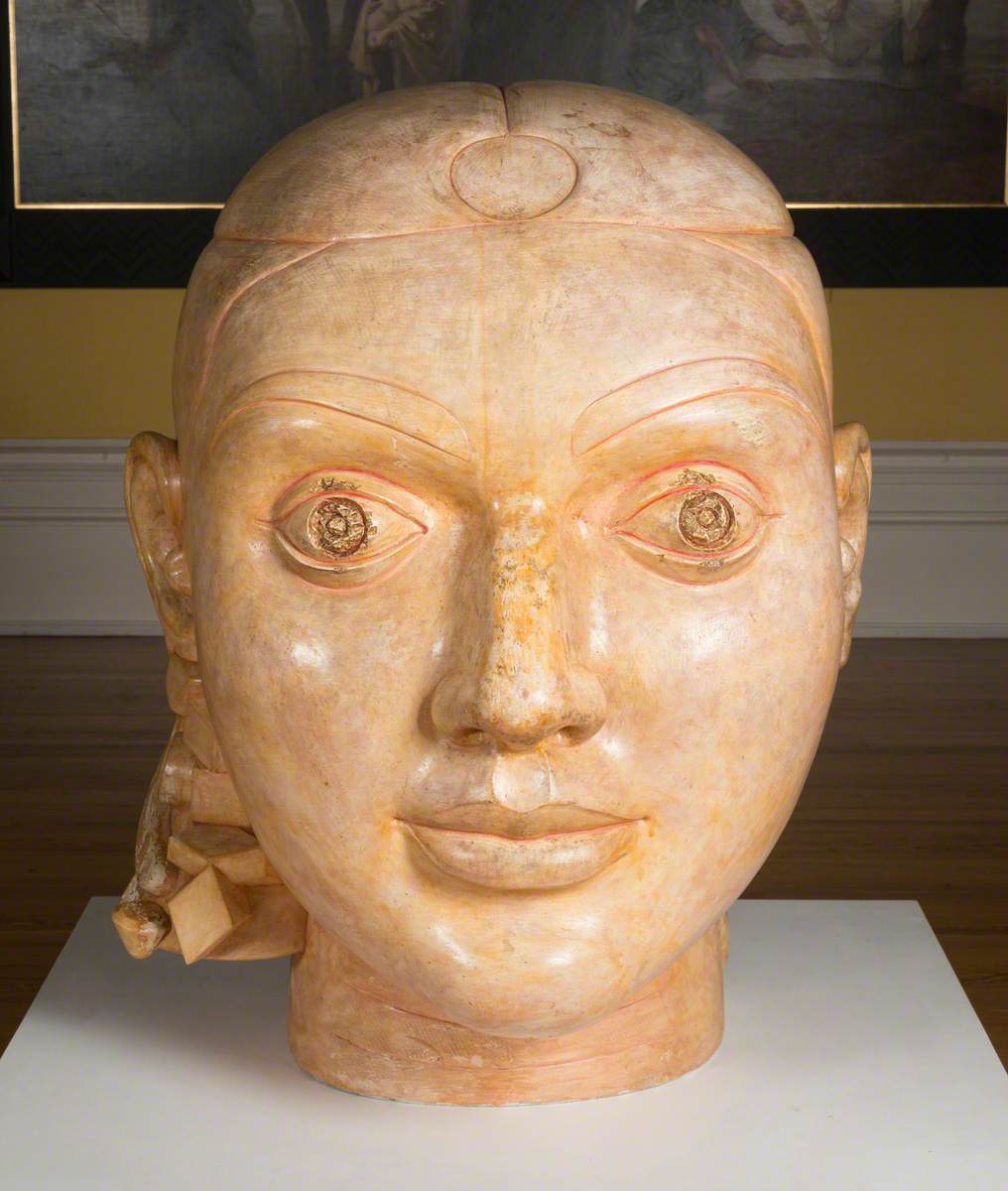 Bust created from plaster and shellac of a women's head.