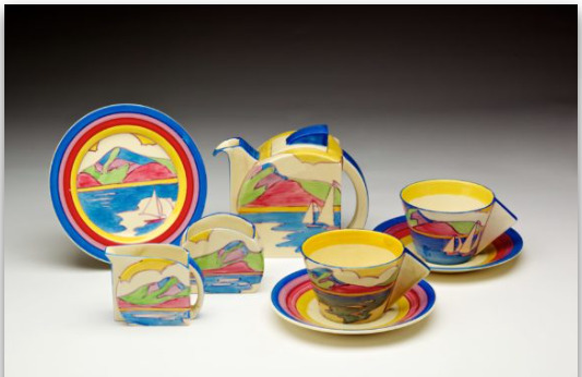 Tea for Two’ tea set painted with Gibraltar seascape. This collection includes plates, cup, saucers, jugs and a teapot and is bright and colourful in shades of blue, green, yellow, pink and red.