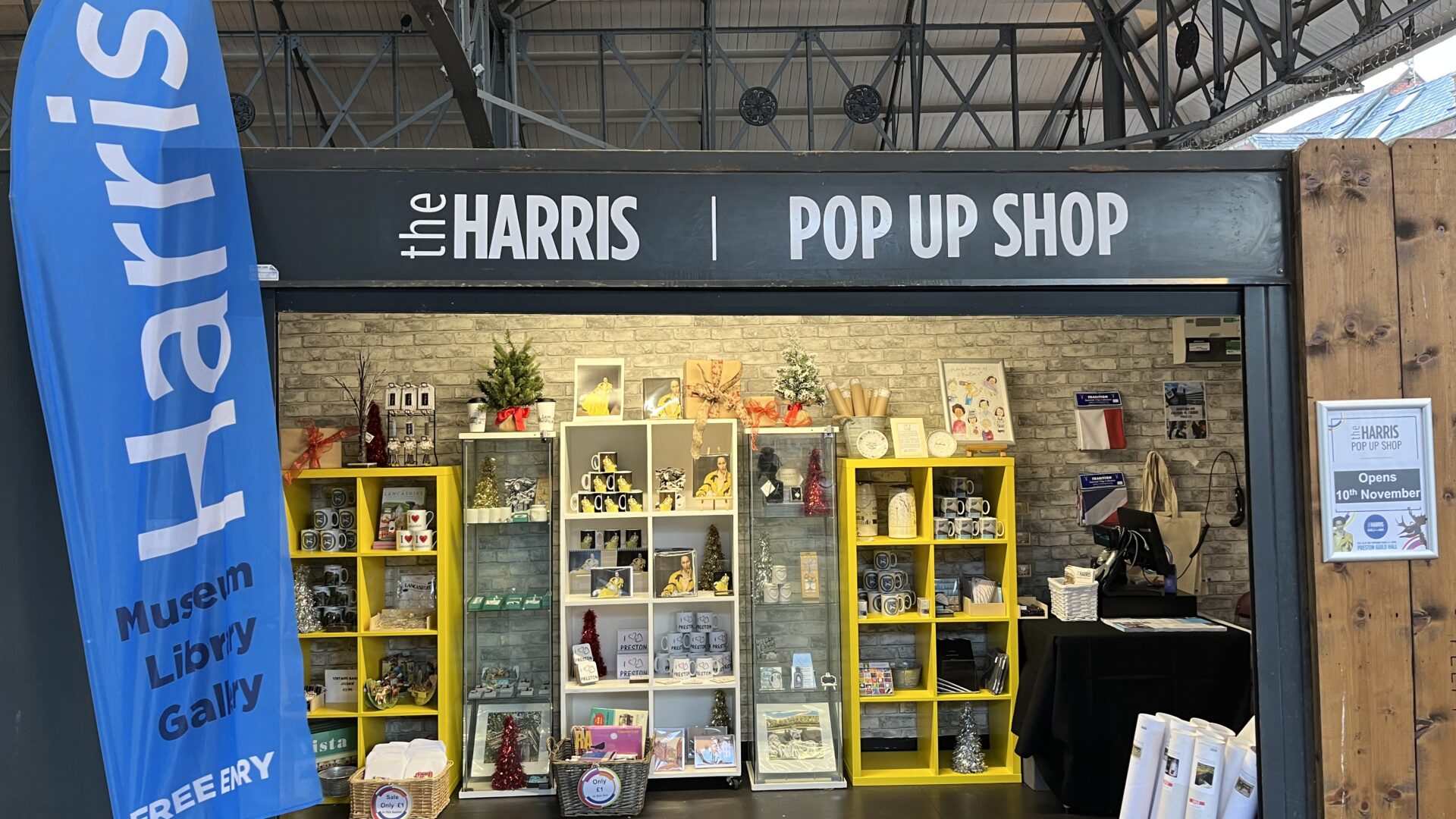 Image of the Harris pop-up shop with items such as notepads and posters