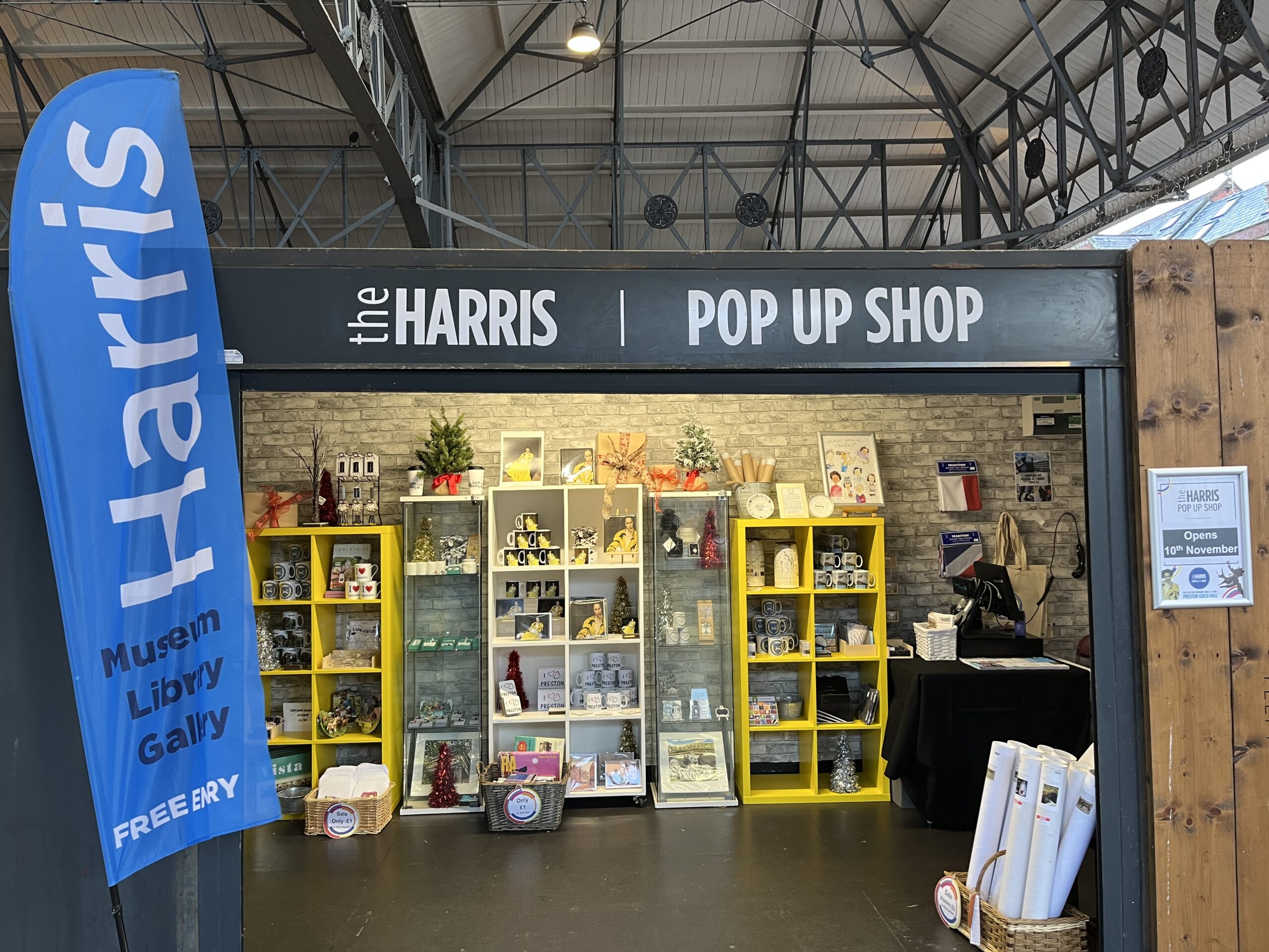 Image of the Harris pop-up shop with items such as notepads and posters