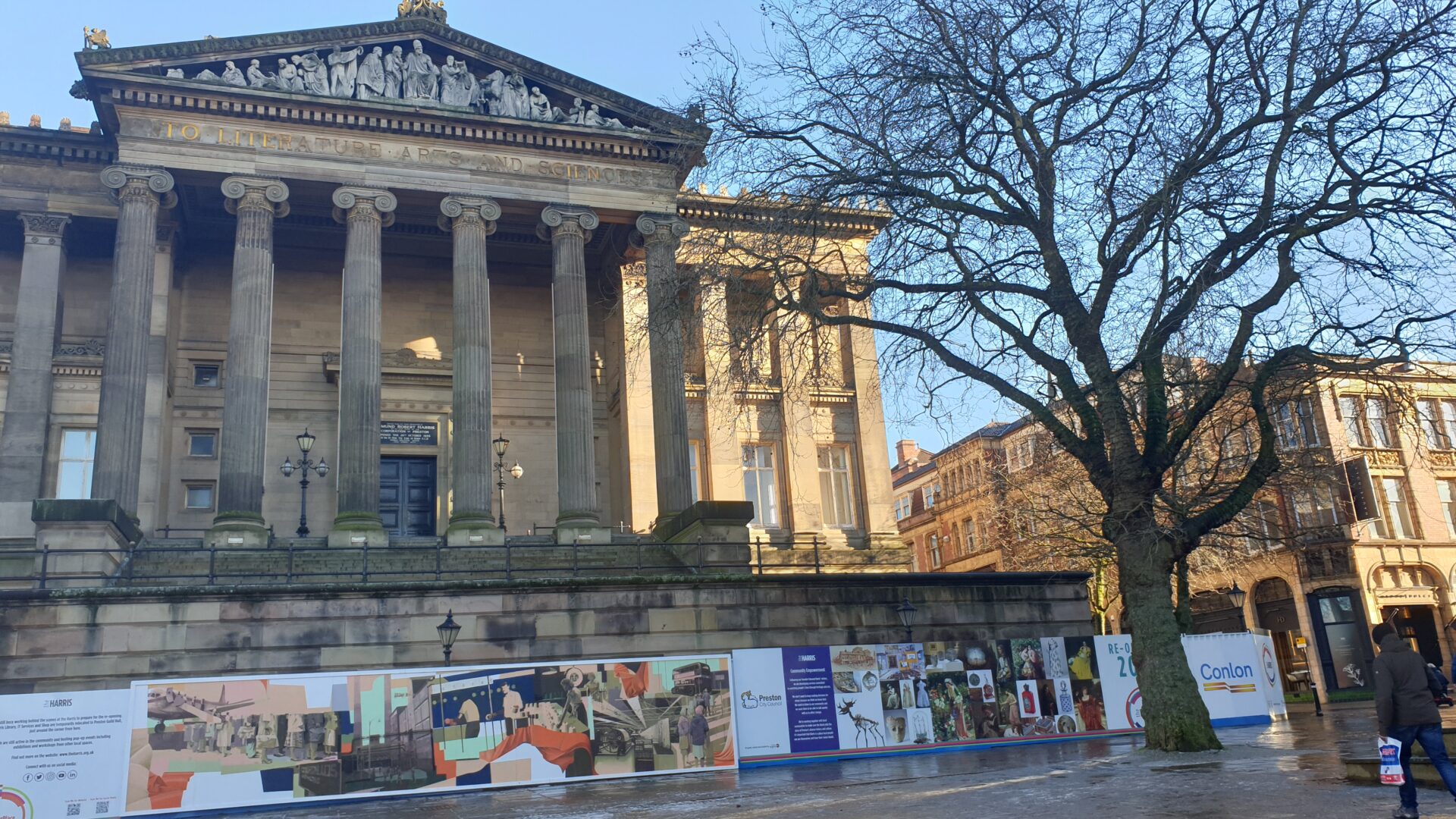 Image of the Harris exterior with colourful hoarding design