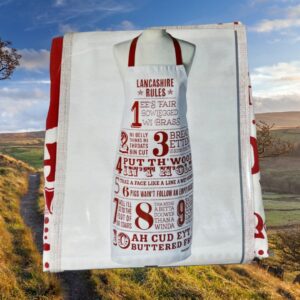 A red and white apron with the boundaries of Lancashire in the background.