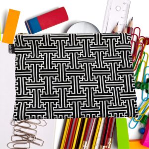 A black and white pouch with stationary in the background.