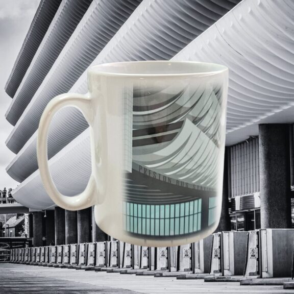 A white mug with an illustration of Preston bus station.