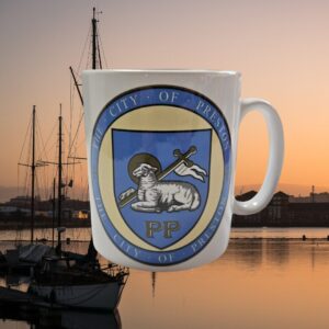 A white mug featuring the Preston crest with the docks in the background.