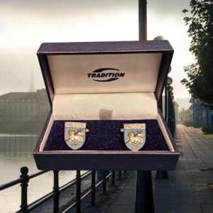 Blue and white Preston cufflinks with the docks in the background.