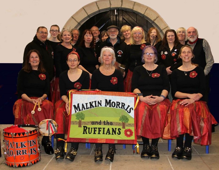 Image of Morris Dancers lined up and smiling