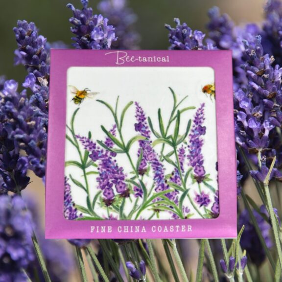 A white ceramic coaster decorated with lavender.