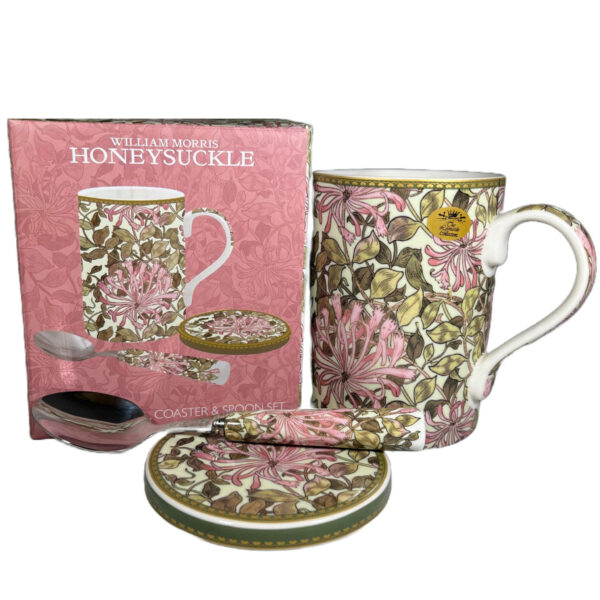 Image of a coaster with matching mug and spoon in a pink floral design.