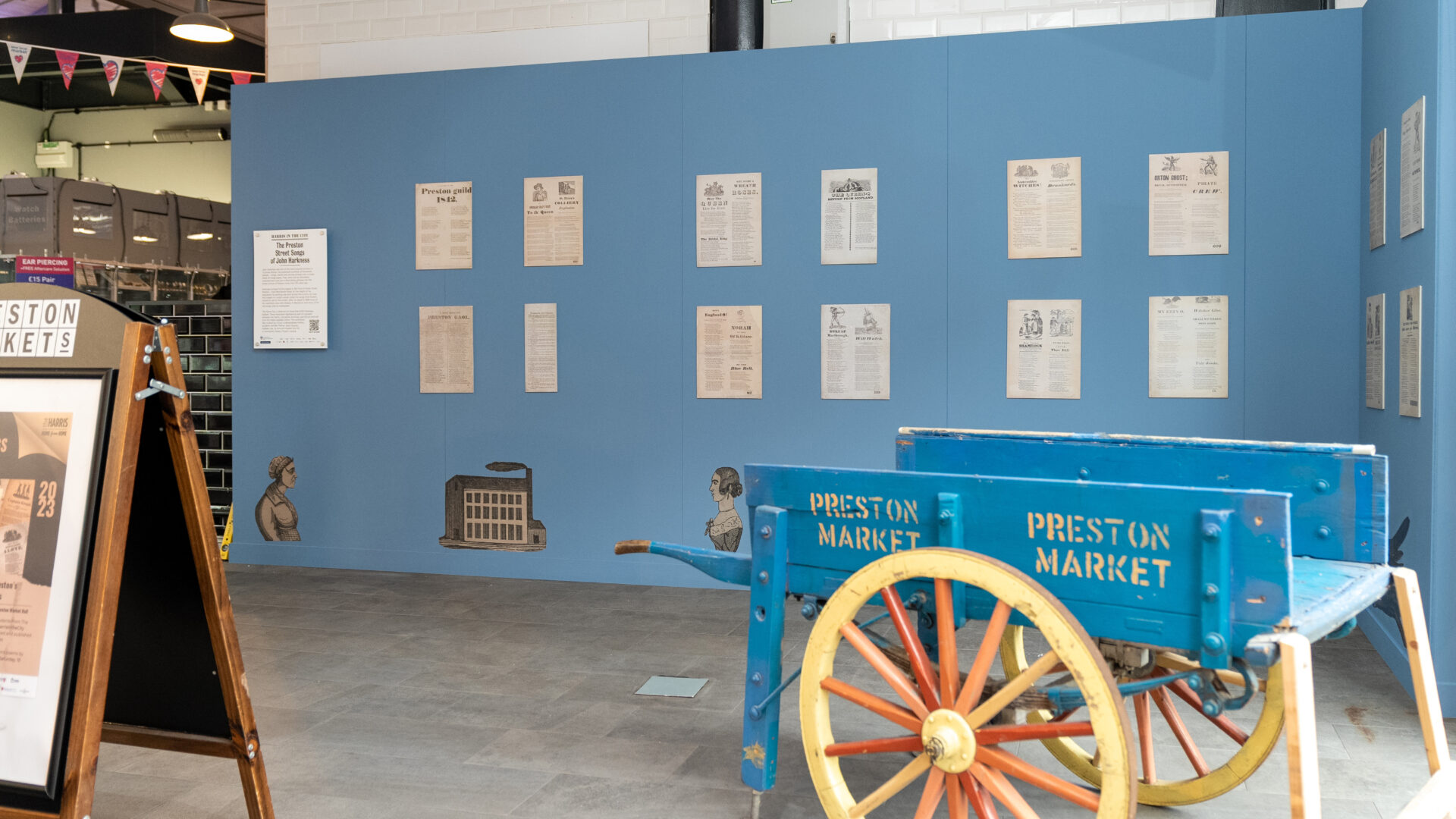 A photograph of the Preston Street Songs exhibition at Preston Markets.