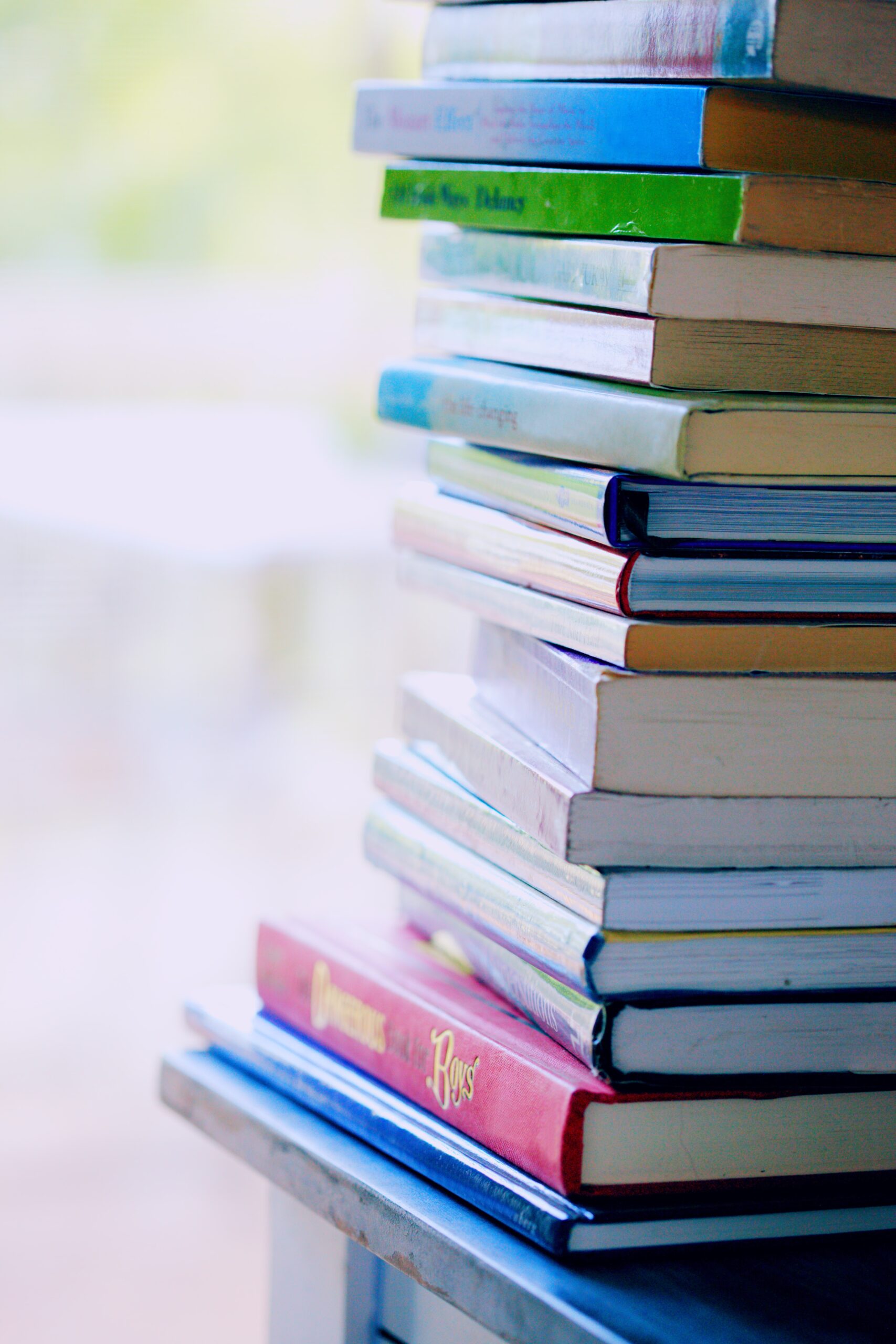 A pile of books stacked on top of one another.