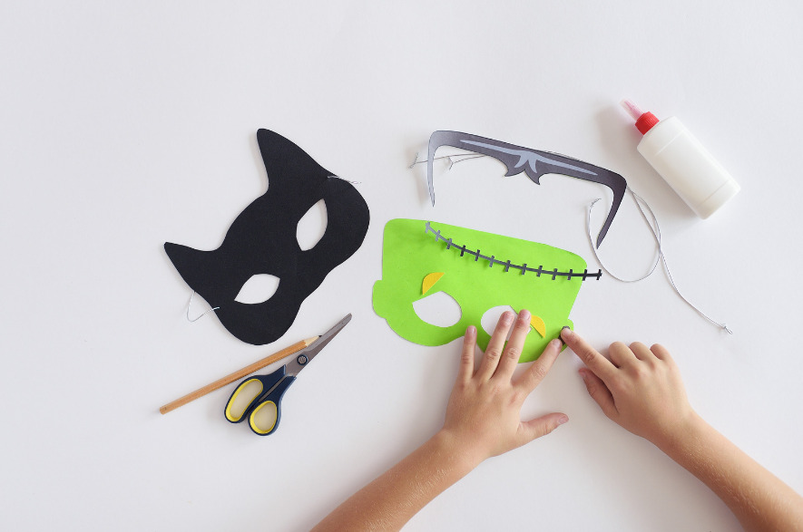 Image of a variety of paper masks in Halloween shapes