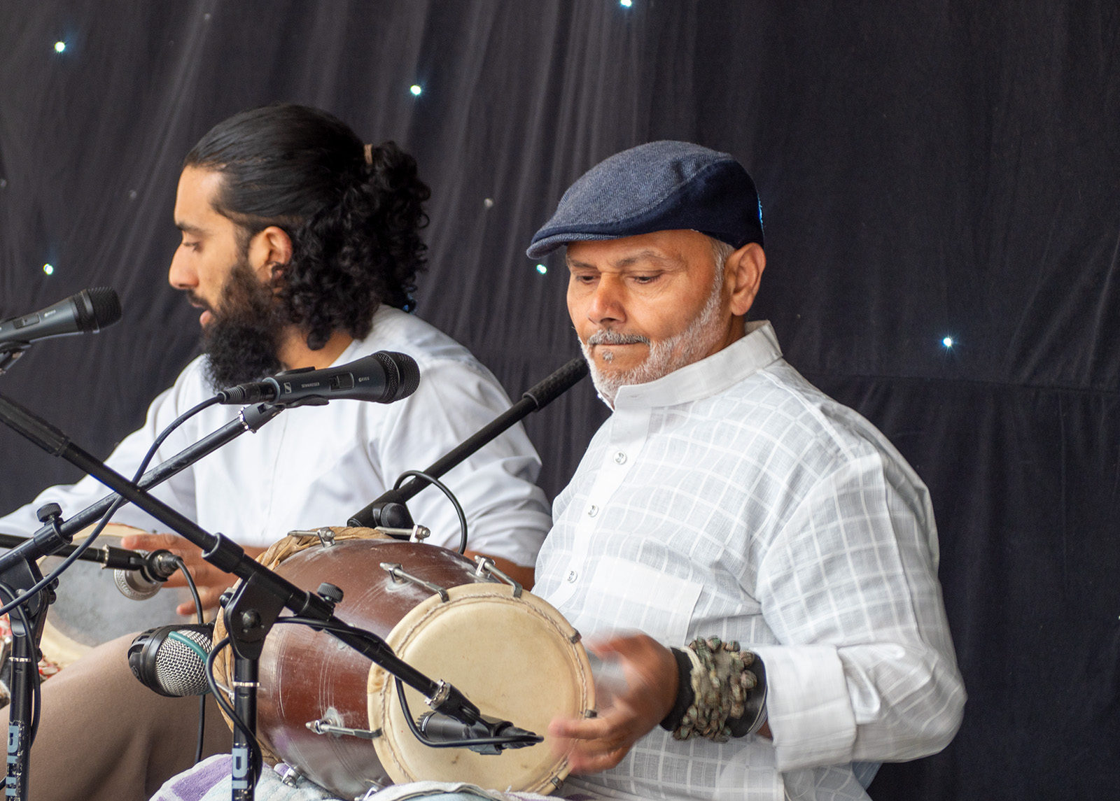 Image of two people playing instruments 