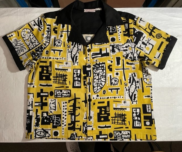 A black, yellow and white patterned shirt.