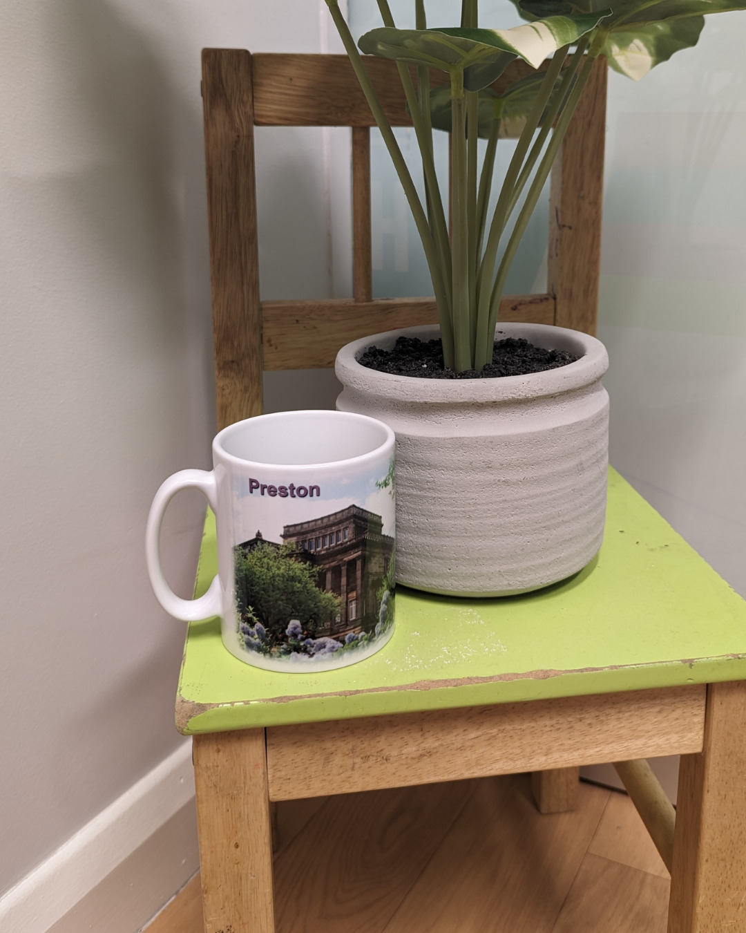A white mug featuring a photograph of the Harris