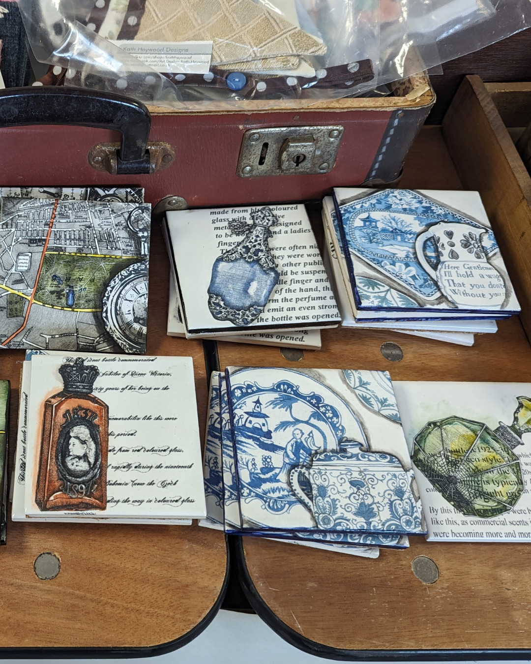 Coasters illustrated with pictures of scent bottles