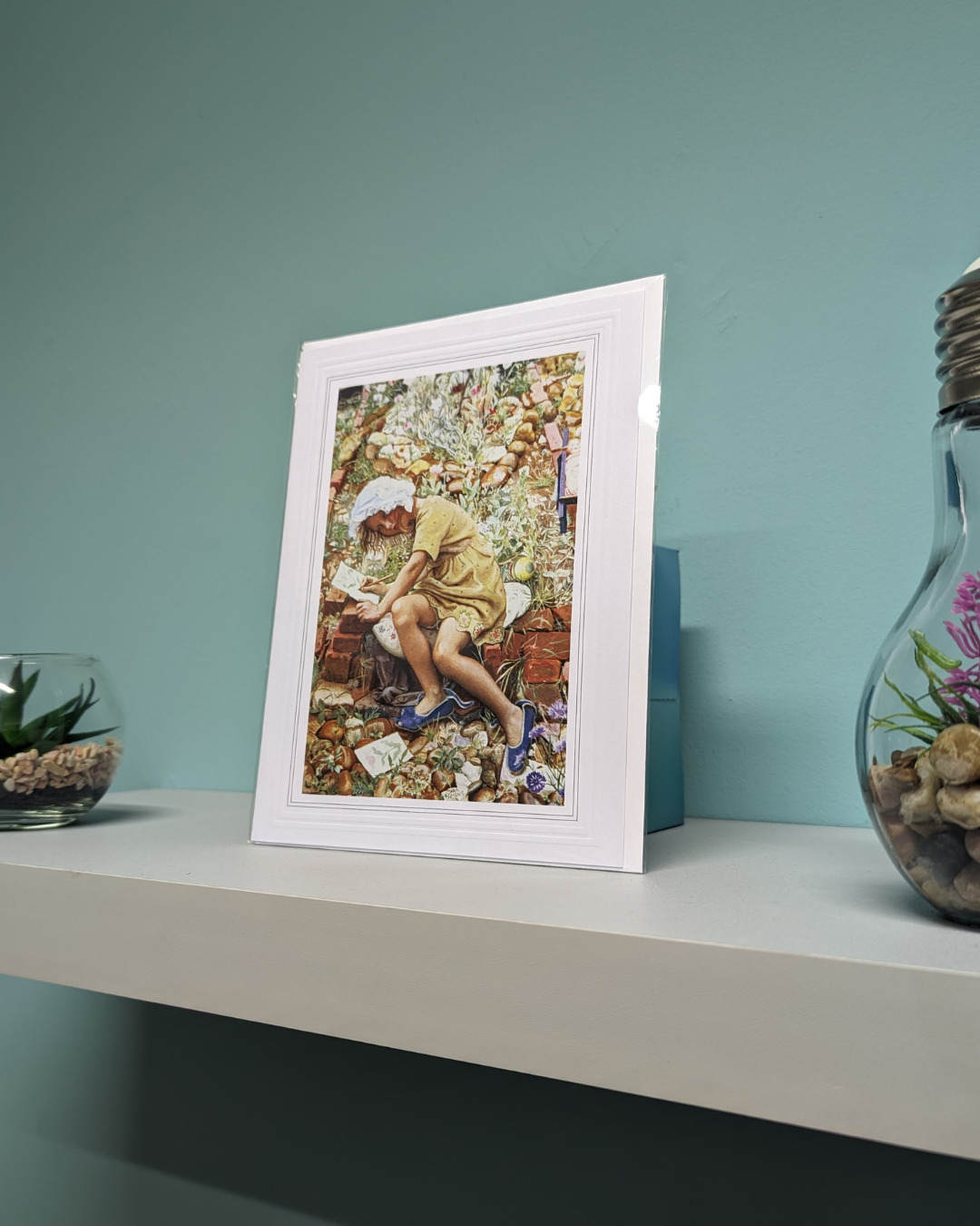An illustrated card placed on a shelf