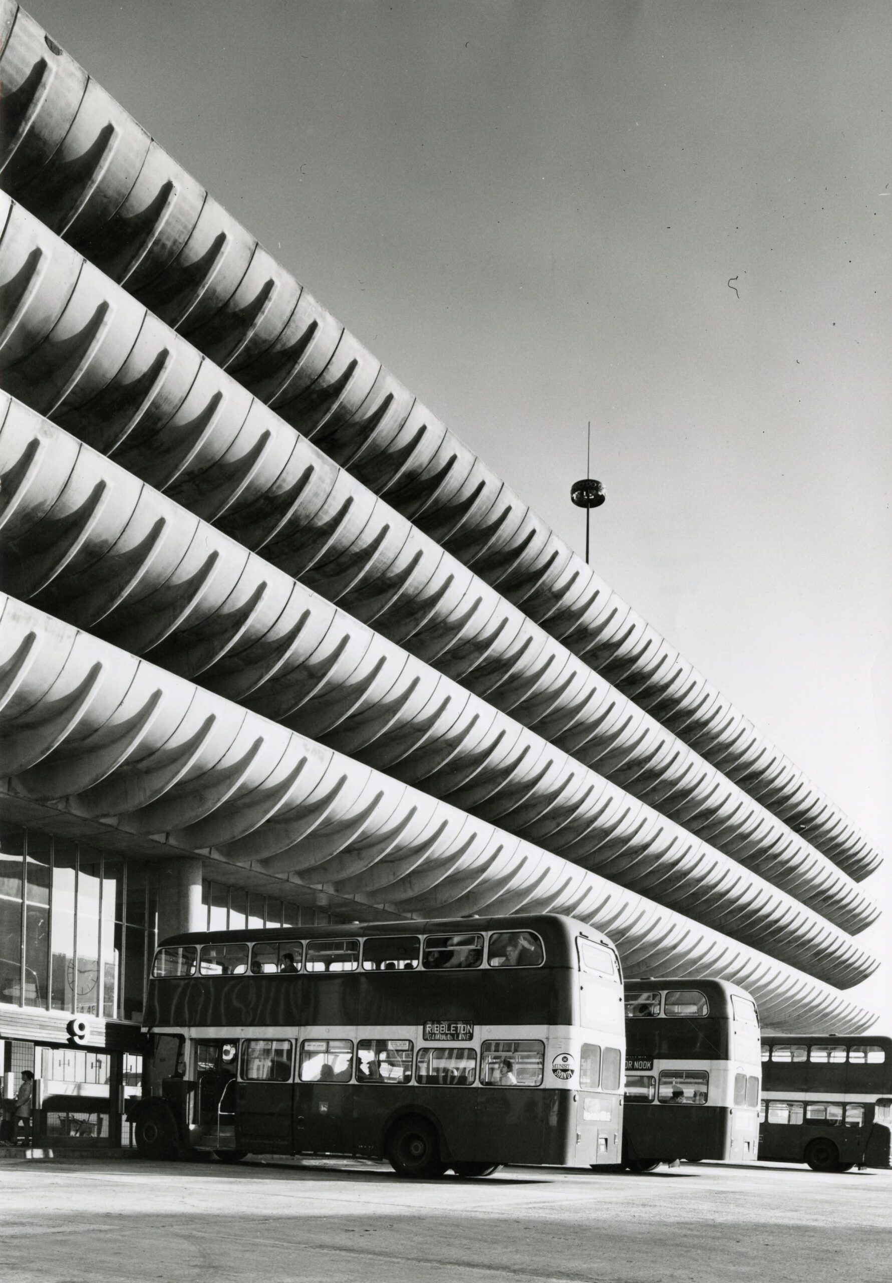 A black and white photograph of Preston bus station.