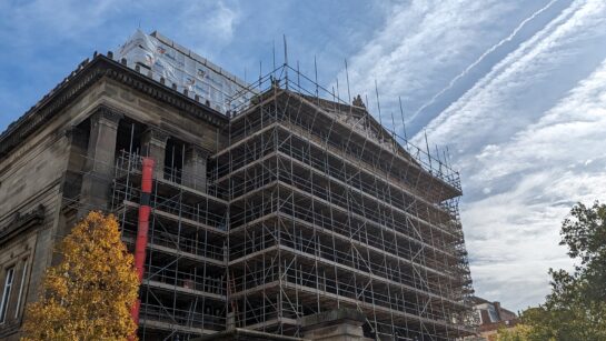Scaffolding covering the façade of the Harris building.