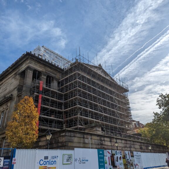 Scaffolding covering the façade of the Harris building.