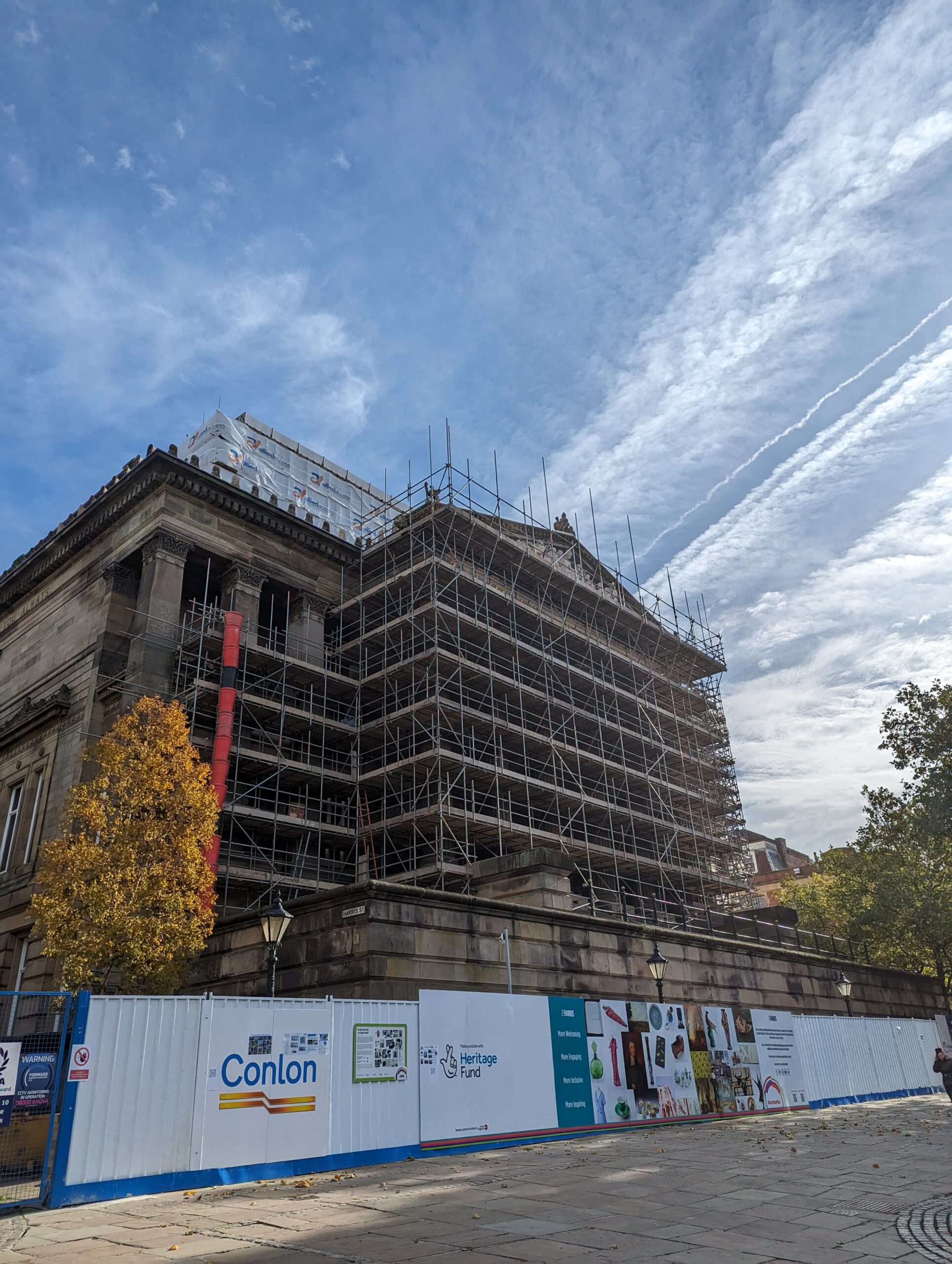 Scaffolding covering the façade of the Harris building.