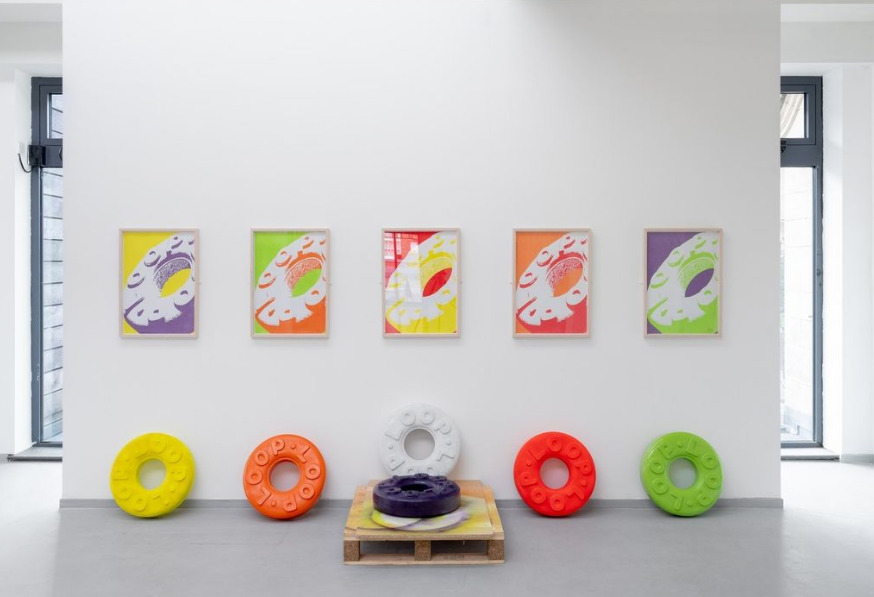 Image of prints of polos and larger scale polo sculpture below each print.