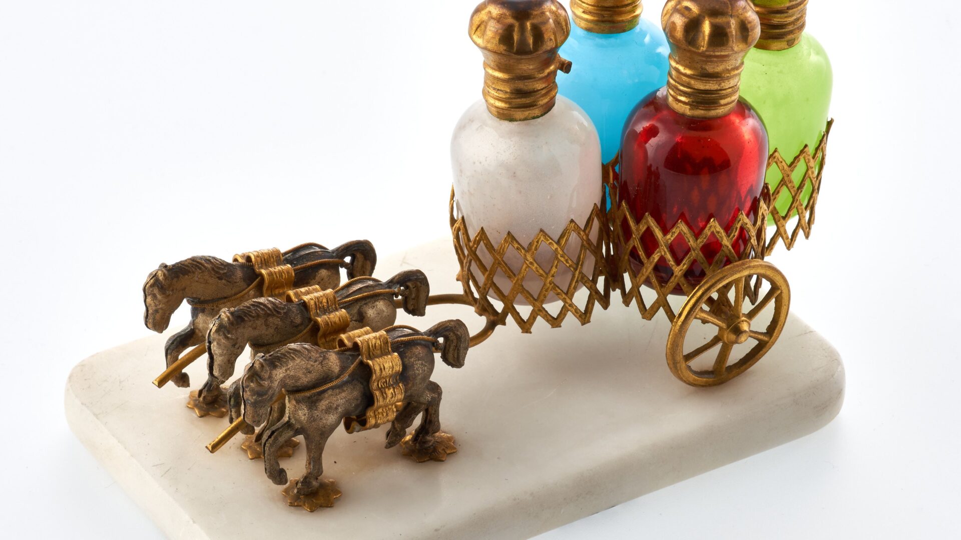 An image of four colourful scent bottles.
