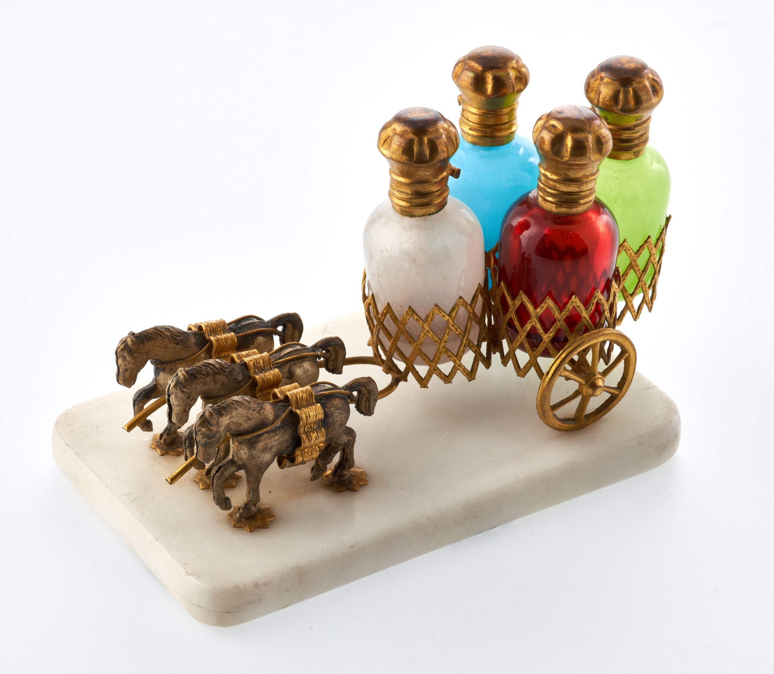 An image of four colourful scent bottles.