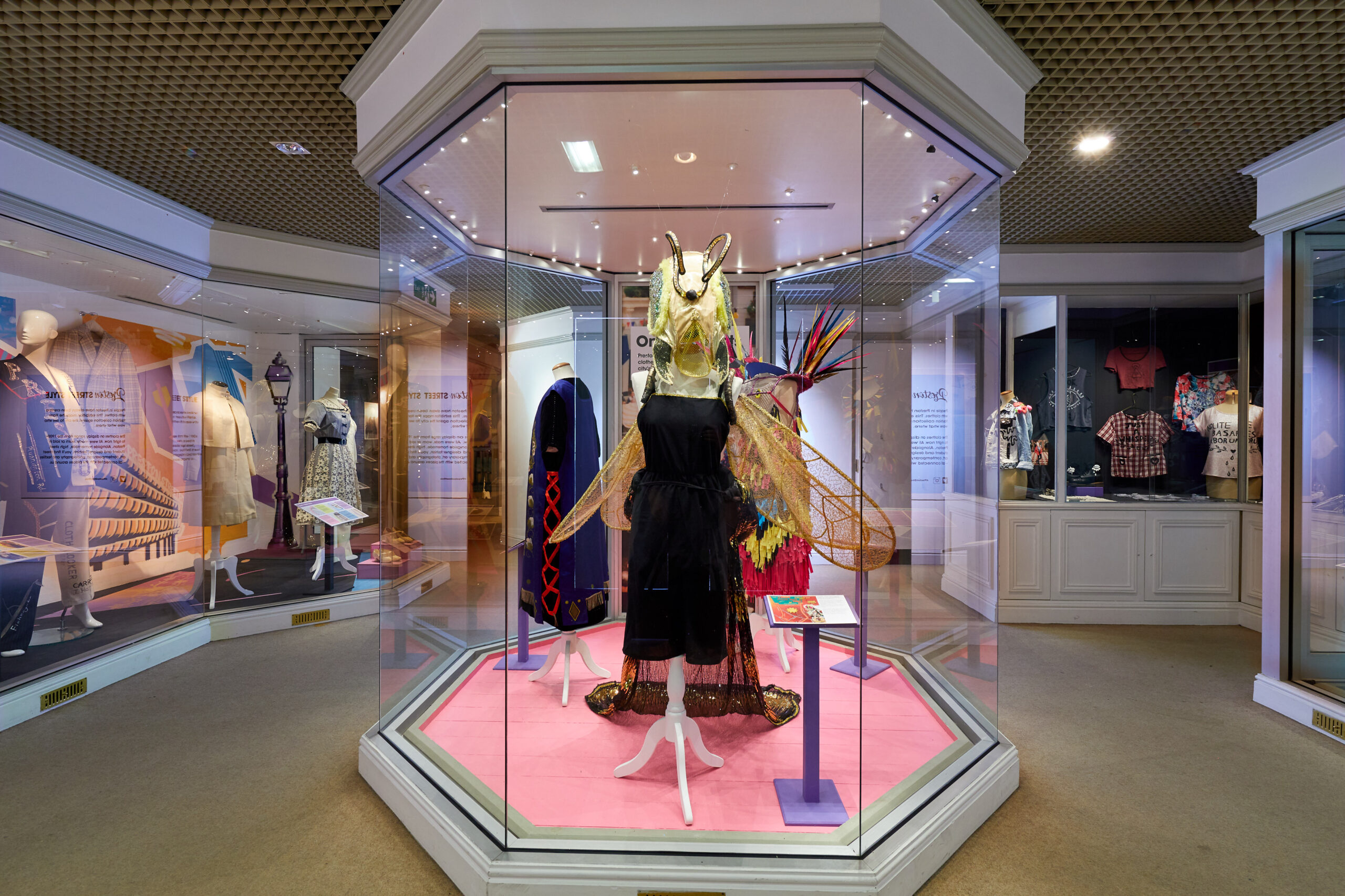 Colourful costumes in glass cases