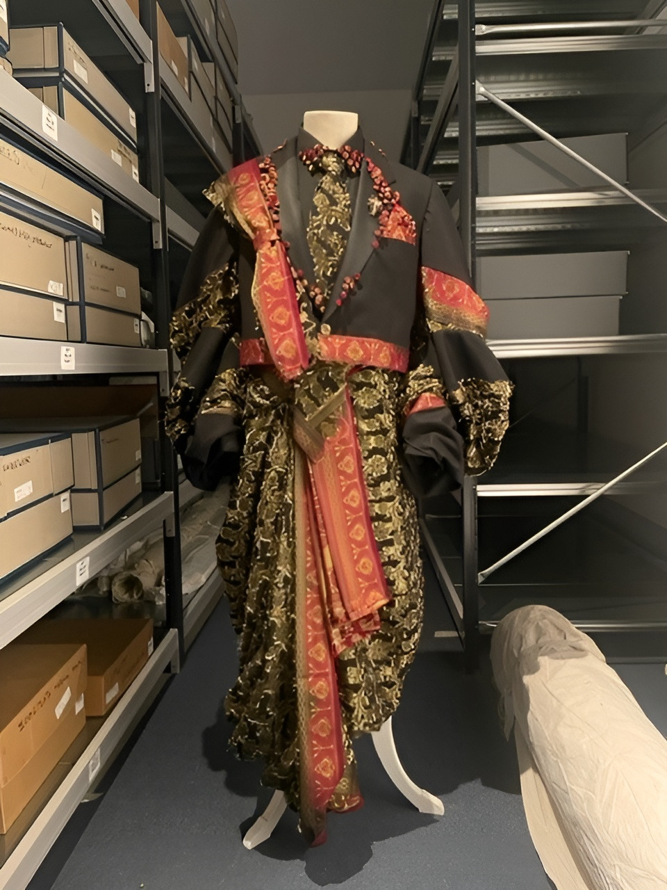 A black, red and gold saree suit.